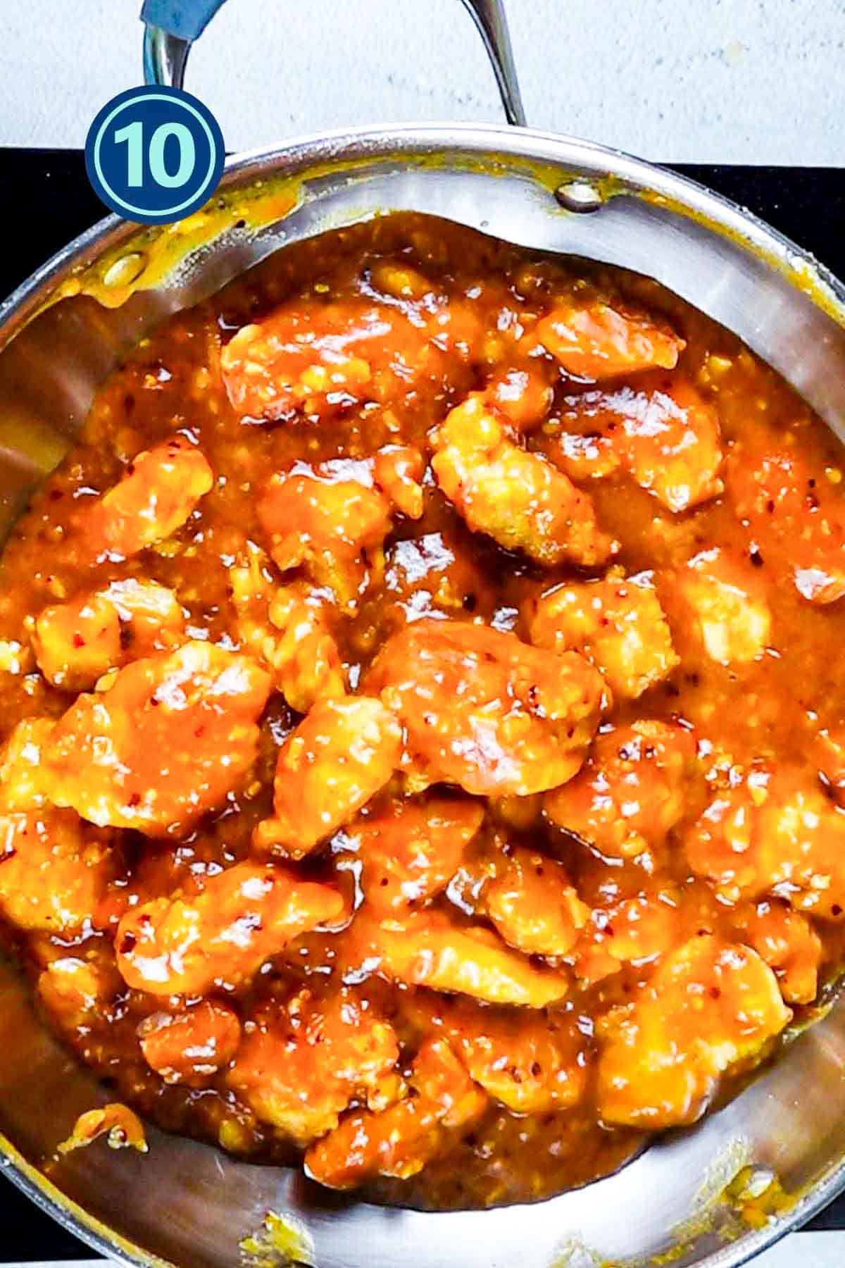 Orange chicken in a frying pan.