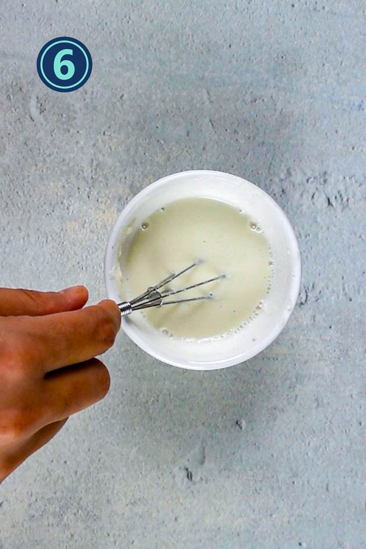 Whisking corn starch in water.