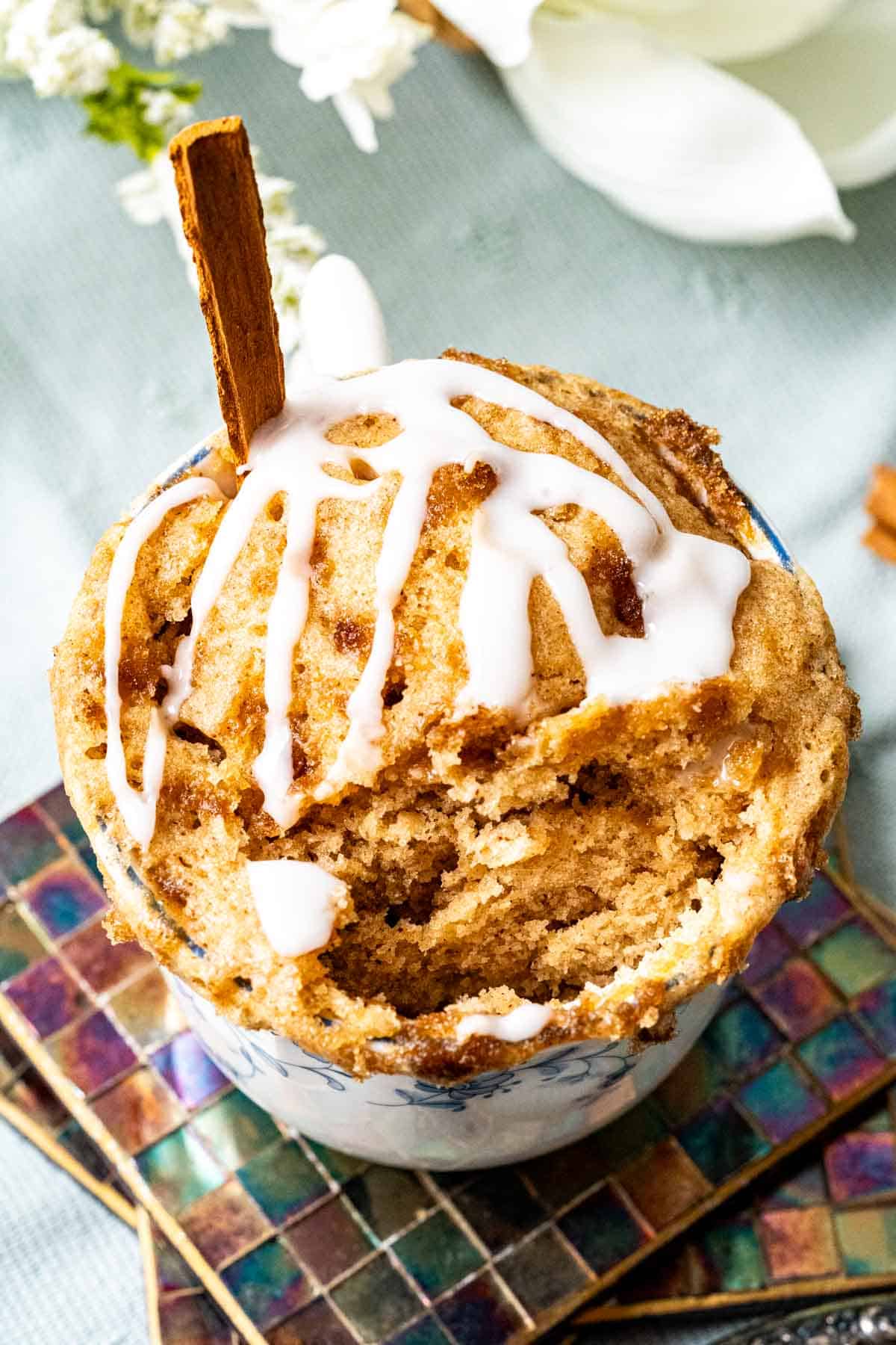 Cinnamon mug cake in a mug showing the moist texture of the cake.