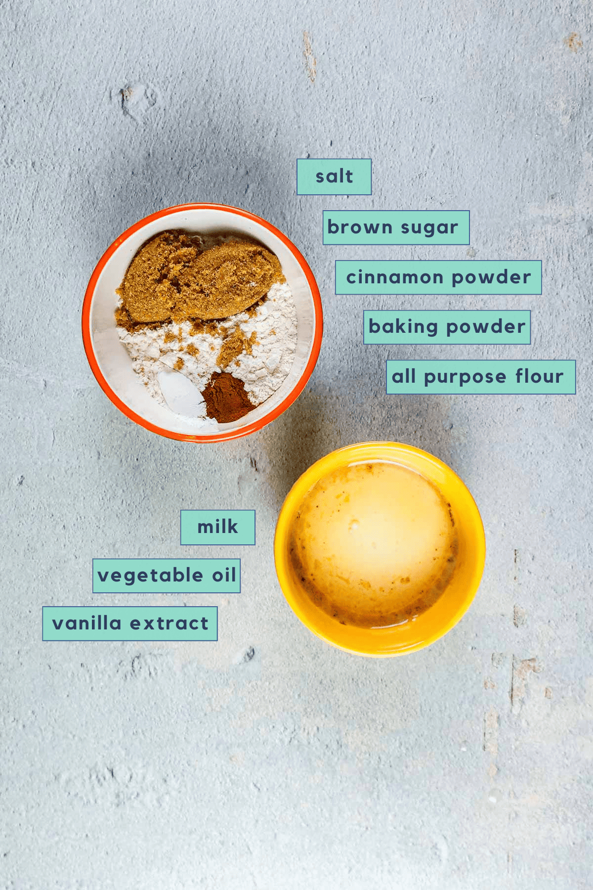 Ingredients for cinnamon roll mug cake sitting on a table.