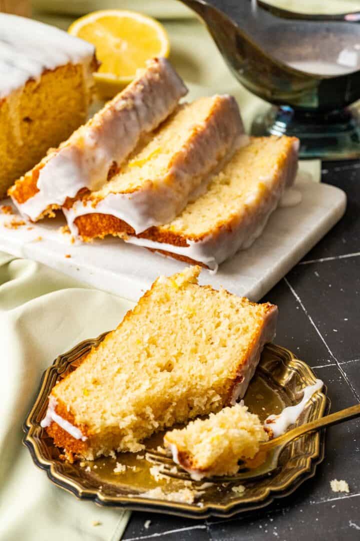 close shot of one slice of the loaf sitting in the golden plate.