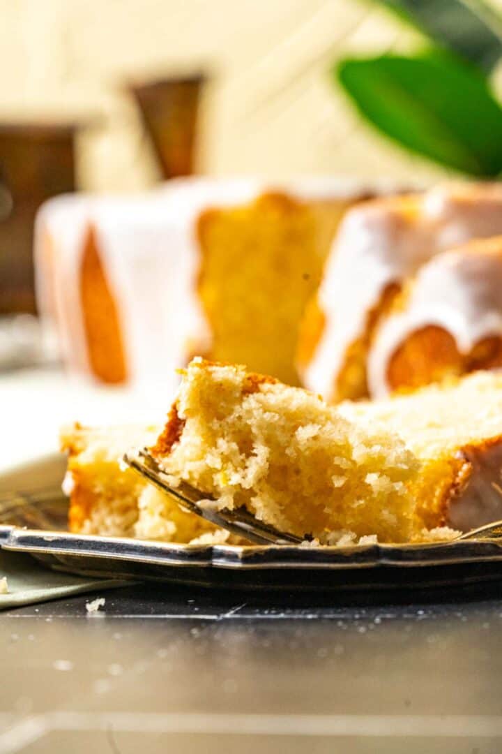 close shot of one slice of lemon loaf on the plate.