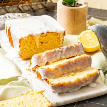 close shot of the lemon loaf cake sitting on the white board.