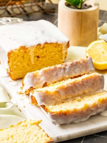 close shot of the lemon loaf cake sitting on the white board.