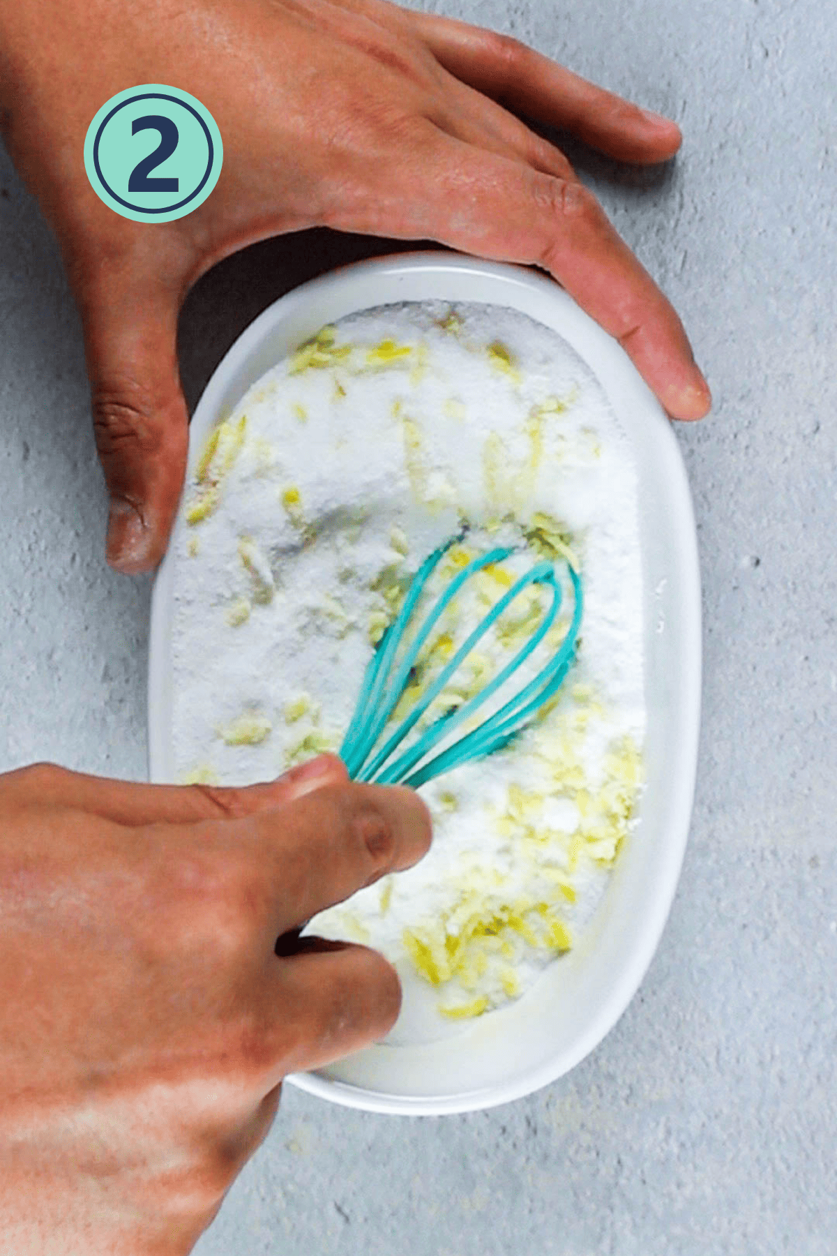 Mixing up the sugar and lemon zest.