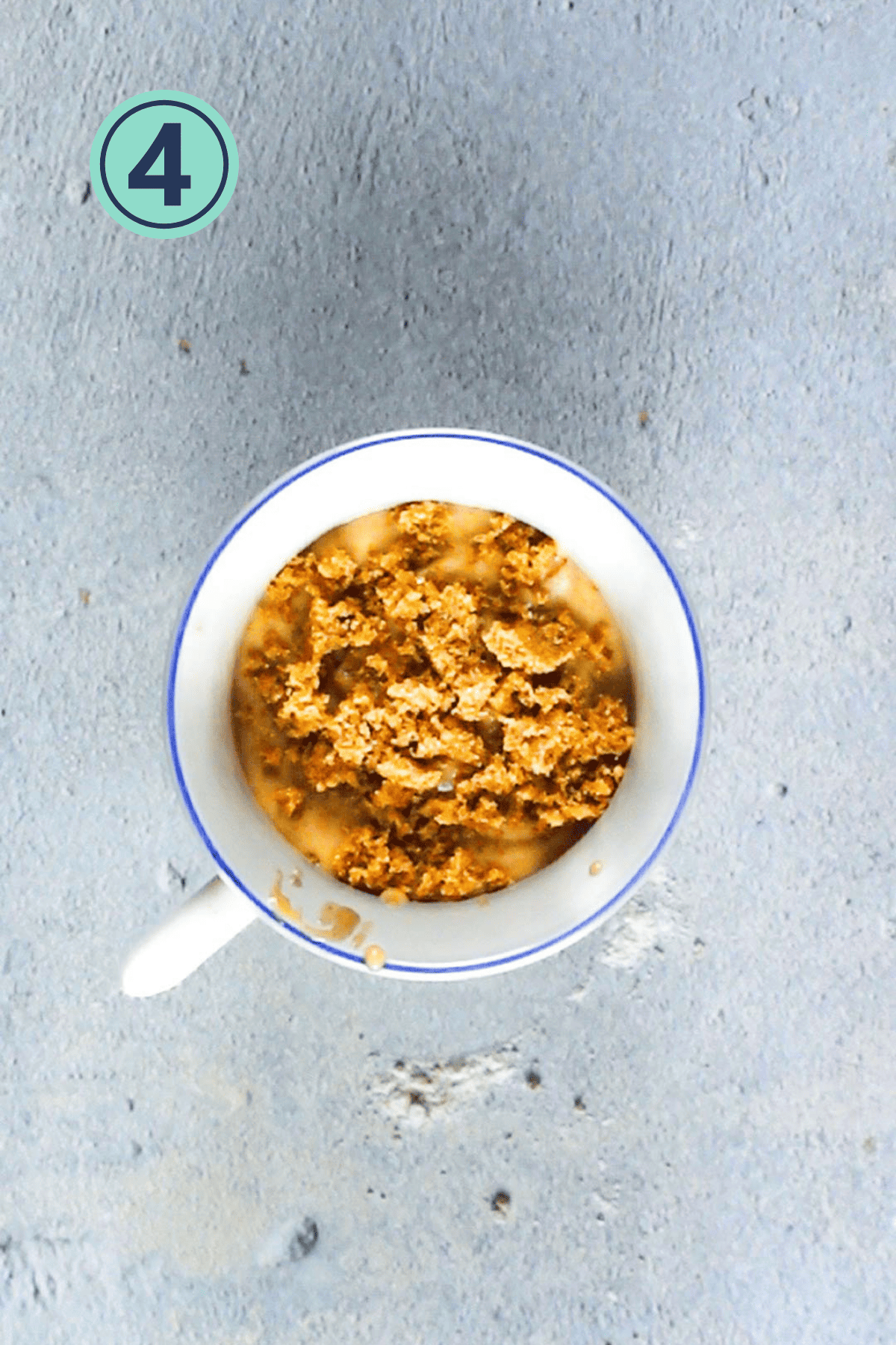 Sprinkled cinnamon mixture on the mug cake.