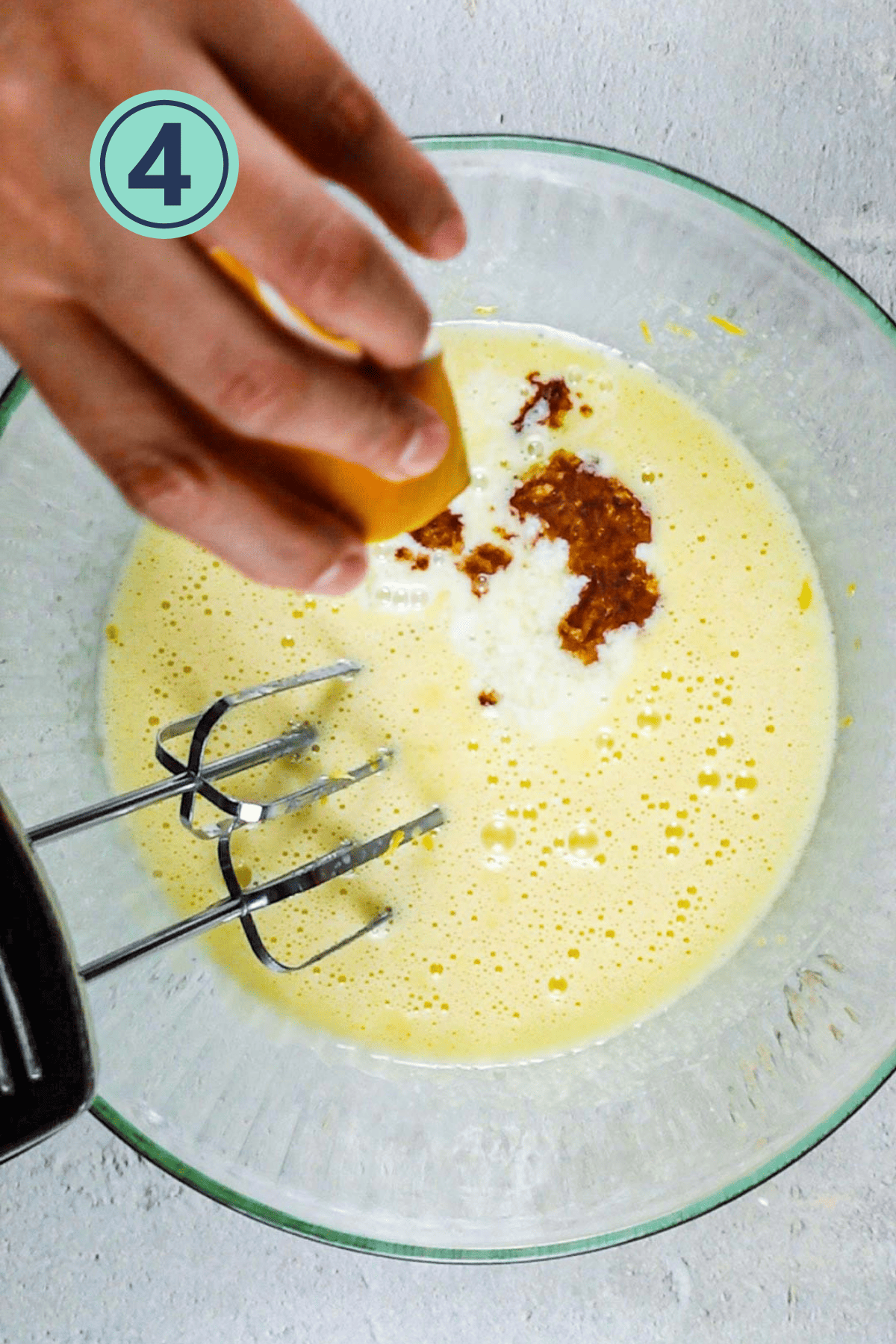 Adding the vanilla extract to the wet ingredients.