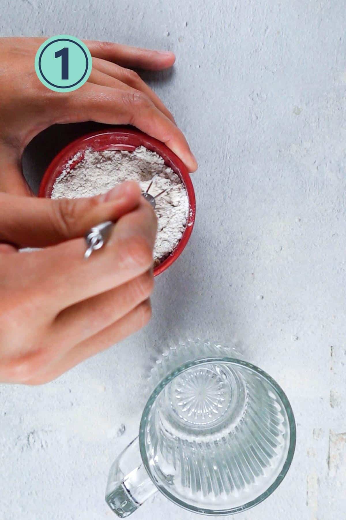 Mixing dry ingredients in a bowl.