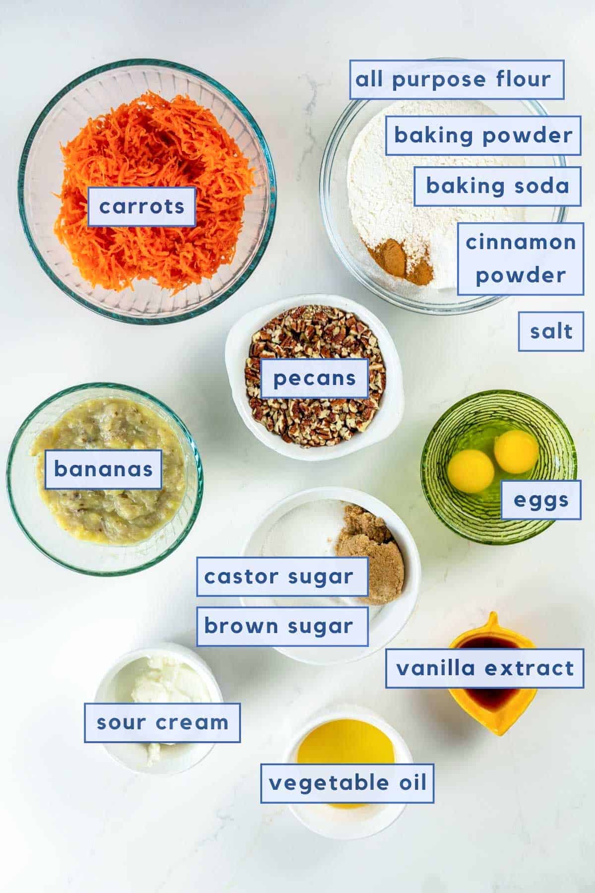 ingredients set on table for banana carrot muffins.